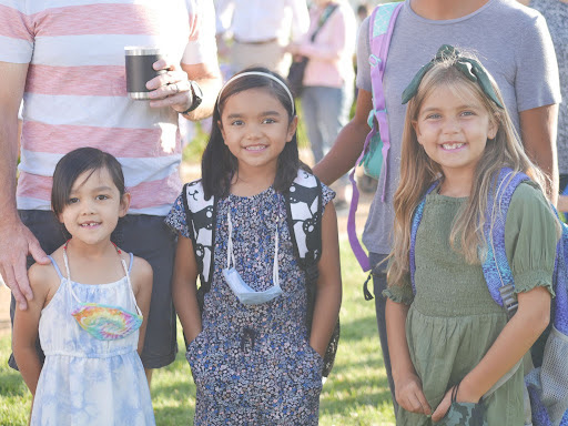 Three students posing for back to school night